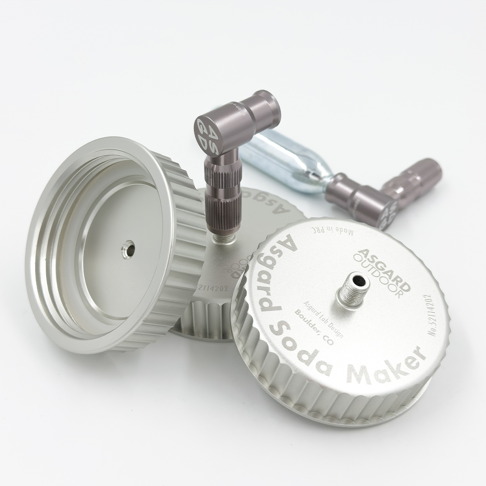 A compact soda maker cap with a CO2 cartridge attached to a jar, used for carbonating beverages outdoors or at home.