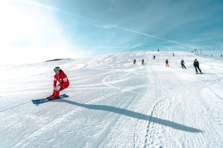Skier clipping a lift pass to a jacket at a gondola entry, illustrating Ikon Pass price decisions-photo-by-pexels