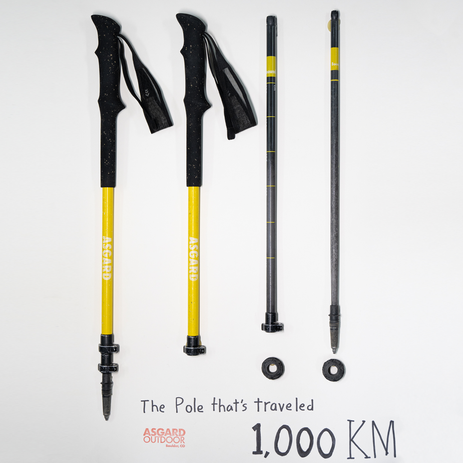 Flat lay of Asgard Hydrogen Poles 2.0 showing full pole components and tips with 1000 KM message