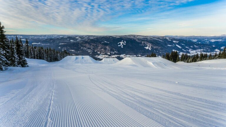 Wisp Ski Resort slopes with McHenry Lodge in the background on a clear winter day-photo-by-pexels